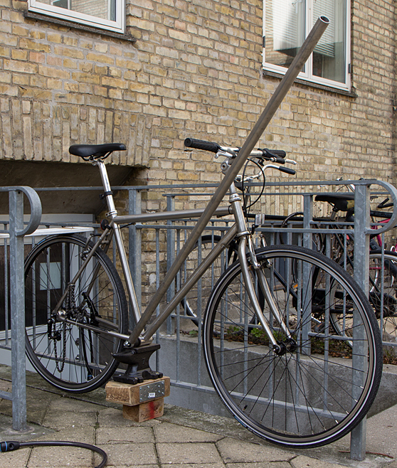 Bike fixed to railings and wrench mounted