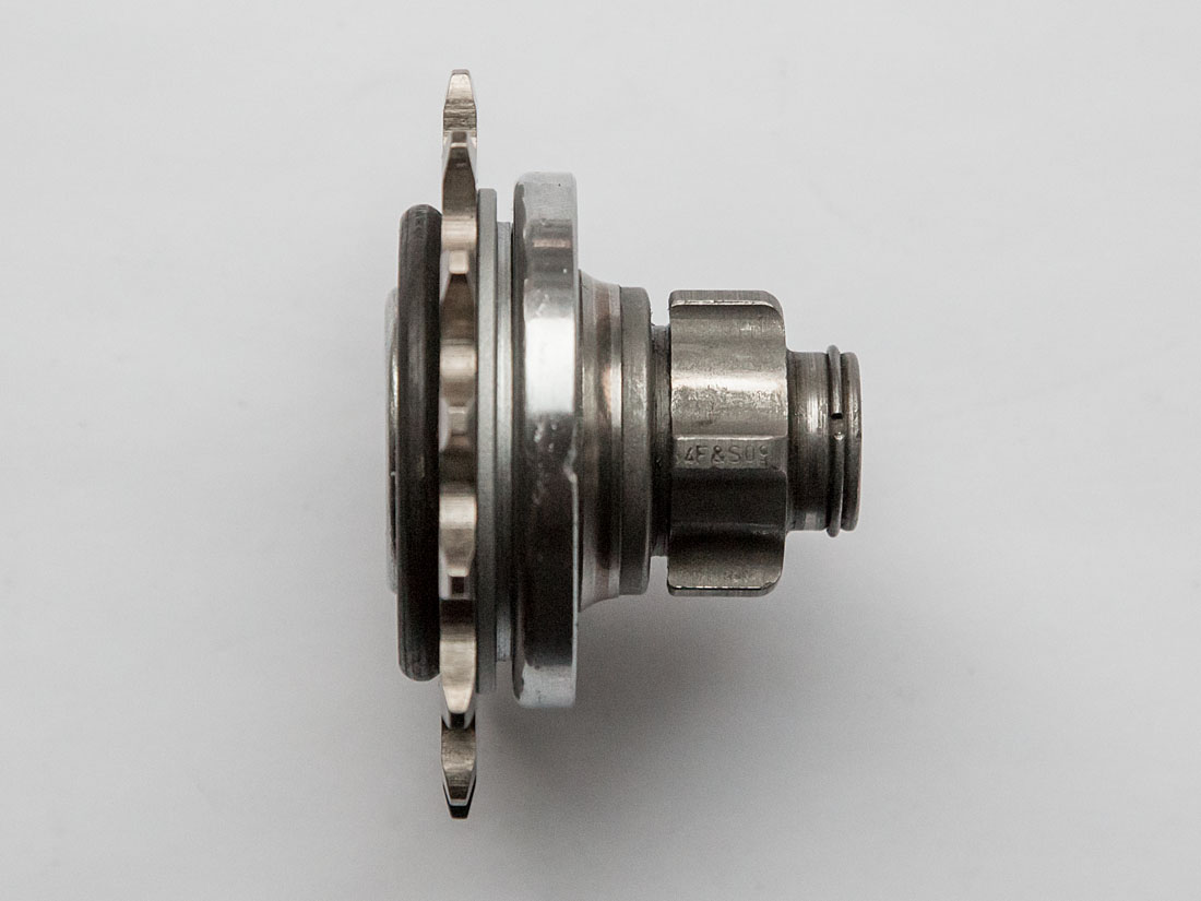 Sprocket and carrier mounted on threaded driver profile