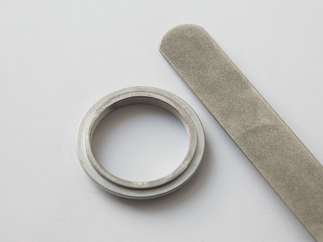 Sprocket carrier hand filing